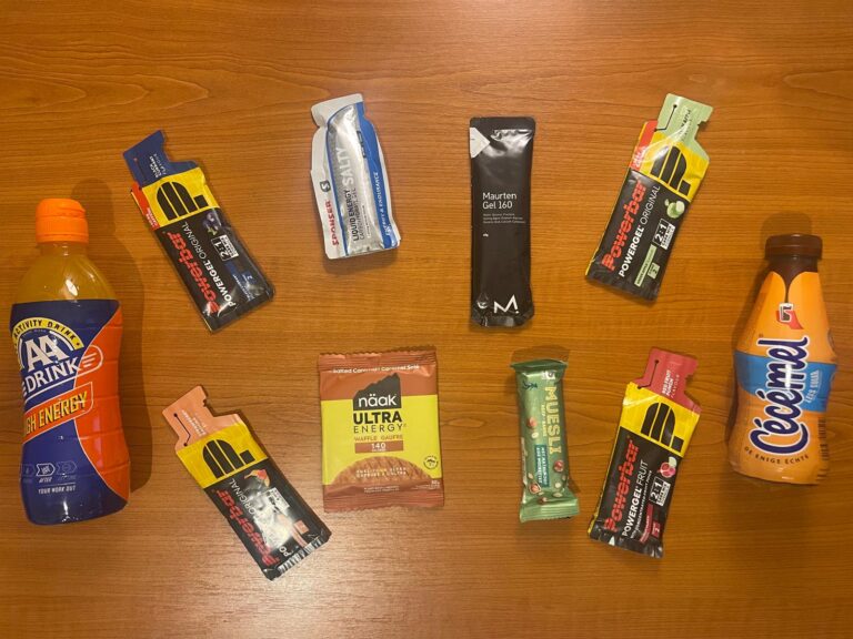 Running fuel options for long runs including energy gels, a waffle, a muesli bar, sports drink, and chocolate milk.