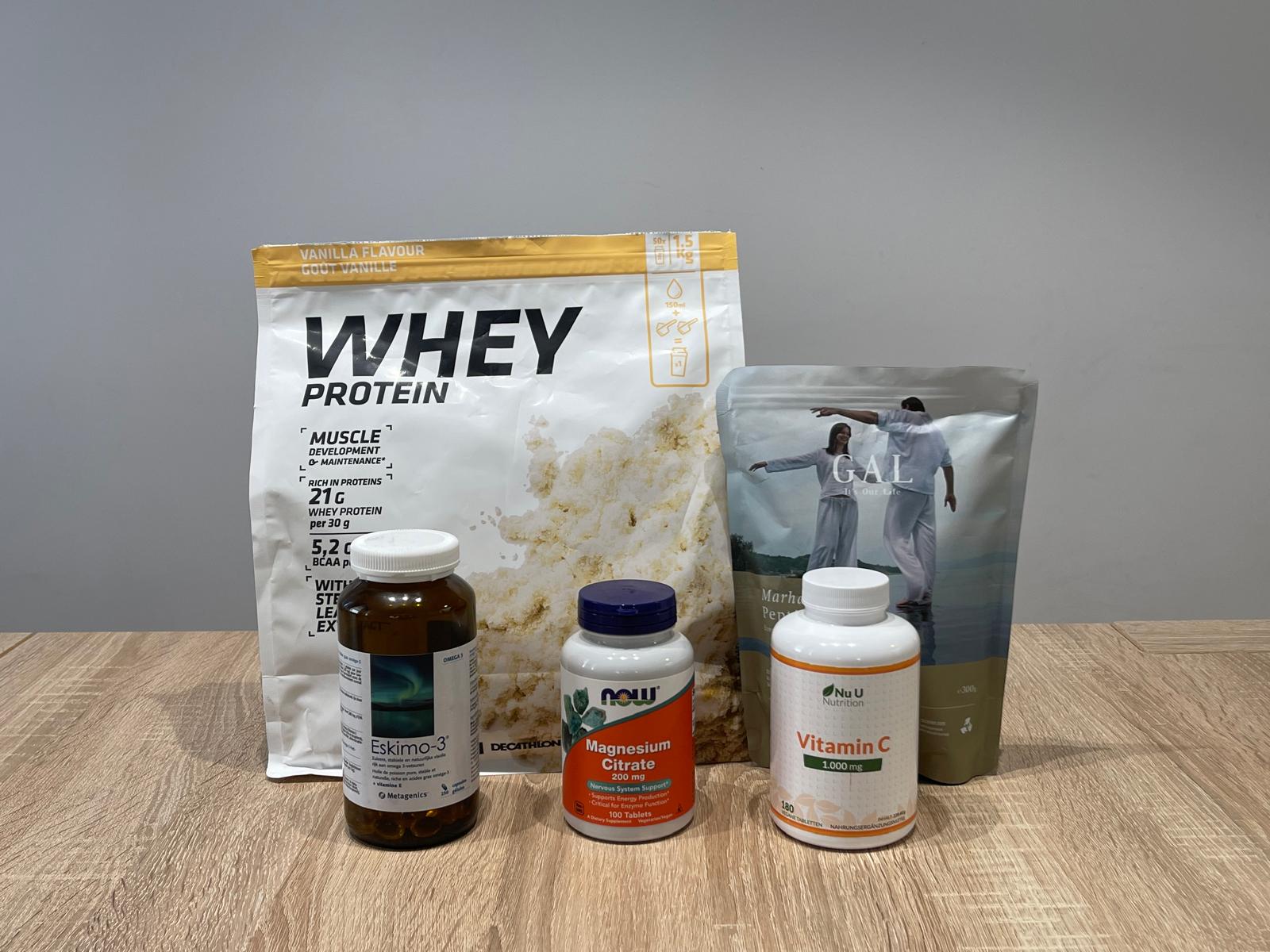 Running supplements including omega-3, magnesium, collagen peptides, vitamin C, and whey protein used to support recovery and performance.