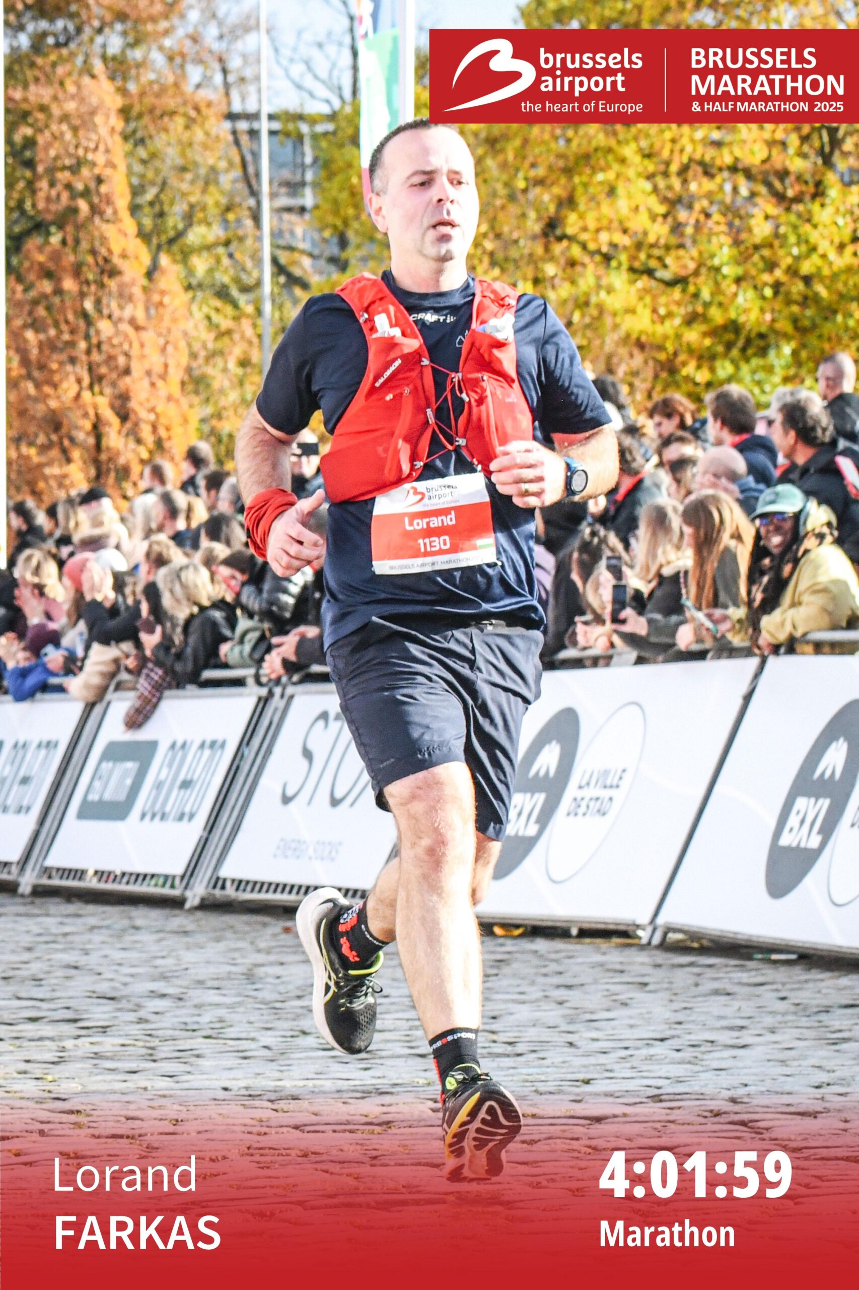 Loránd crossing the finish line at the Brussels Airport Marathon 2025, soaked from rain but looking strong at the end of the race.